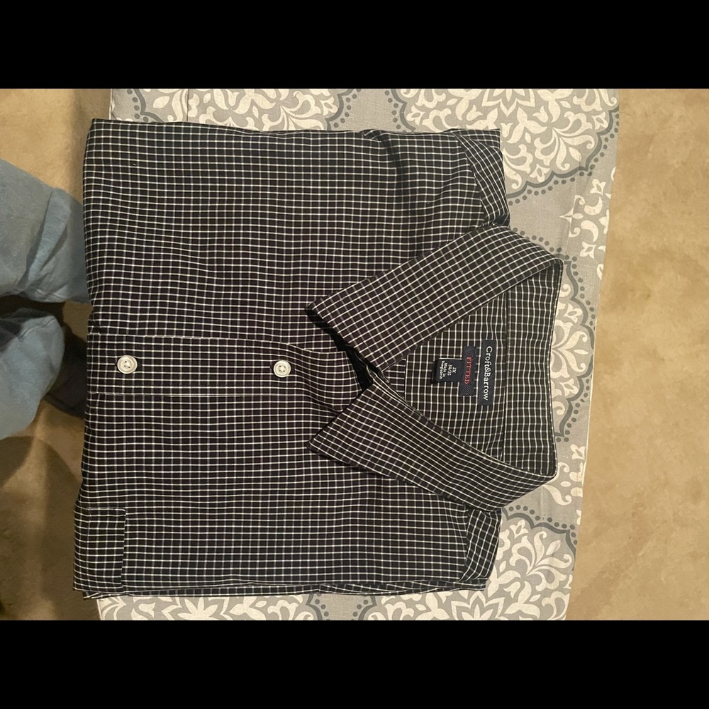 Button down check-pattern dress shirt.